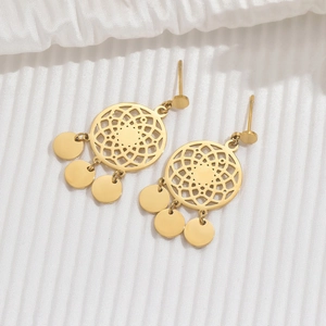 Golden stainless steel dreamcatcher drop earrings with dangling metal discs on white fabric