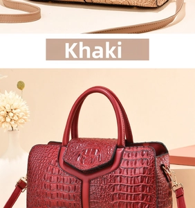 Close-up of crocodile embossed texture on luxury burgundy and khaki boston handbags