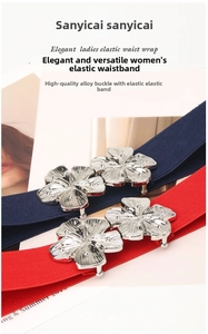 Close-up of floral alloy buckles on navy and red elastic waist belts for women