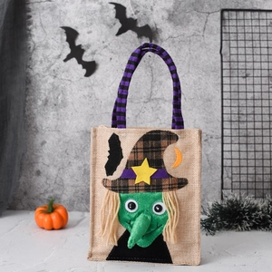 Linen Halloween candy bag with 3D witch appliqué and purple striped handles on gray background
