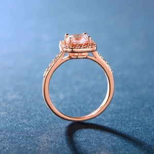Macro detail of rose gold square cut zircon ring with side stone pave accents