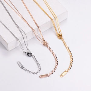 Detailed view of silver, rose gold, and gold layered necklaces with adjustable lobster clasp