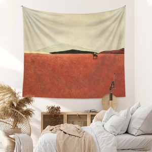 Close-up of minimalist landscape tapestry with mountain art in a cozy bedroom setting