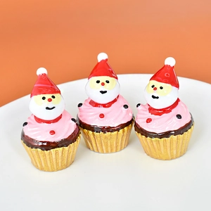 Three Santa Claus cupcake miniatures made of resin for Christmas table decoration