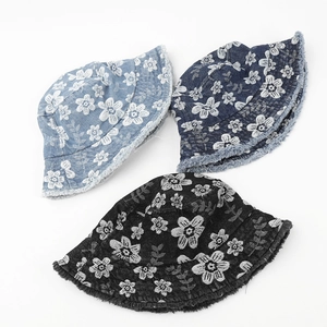 Distressed floral denim bucket hats with frayed edges in light blue, dark blue, and black