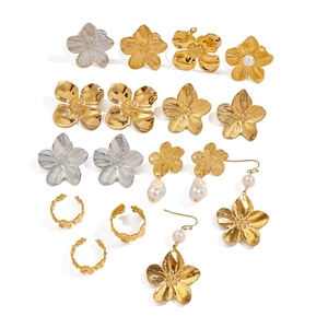 Elegant floral pearl earrings and rings set in gold and silver stainless steel finish