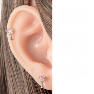 Detail of silver goblet stud earring featuring a heart-shaped pink zircon stone