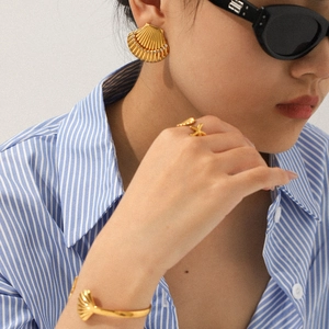 18k gold plated stainless steel ocean theme shell earrings and jewelry set on a model