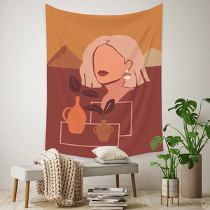 Artistic detail of bohemian tapestry with abstract female portrait and warm terracotta tones