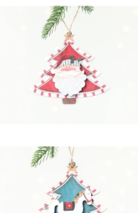 Detail showing vintage wooden Santa and rocking horse ornaments on a pine branch