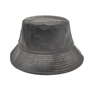 Detail showing the vertical ribbed texture and fine stitching on a black bucket hat