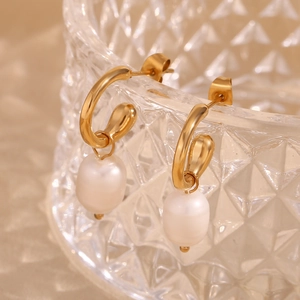 Detailed close-up of 18K gold-plated hoop earrings with elegant freshwater pearls