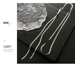 Detail view of silver lariat necklace featuring adjustable slide buckle on snake chain