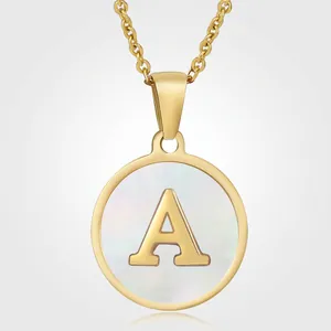 Macro shot of 18K gold plated necklace showing mother of pearl letter A pendant