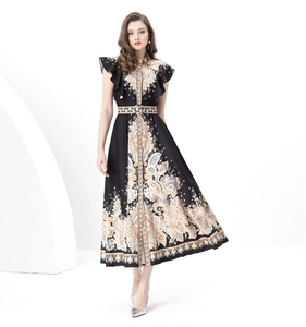Detail of royal paisley print and ruffled short sleeves on a belted waist maxi dress