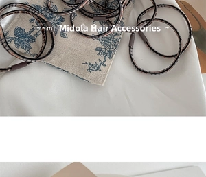 Macro detail of high-elastic leopard print hair ties with durable cylindrical connectors