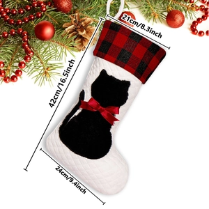 Christmas stocking with red and black plaid cuff, black cat silhouette, and size dimensions