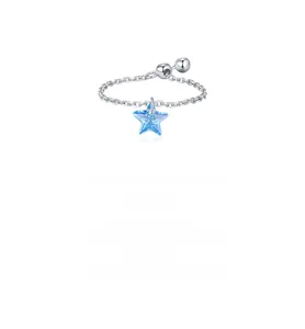Macro shot of chain-style silver ring with blue star crystal pendant and bead accents