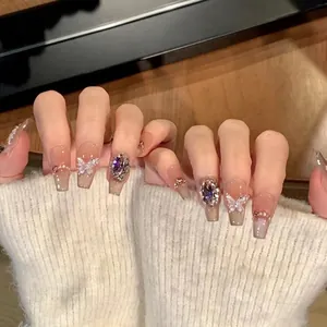 Handmade press-on nails with 3D butterfly, purple crystals, and cat eye blush finish