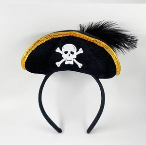 Detail of Halloween pirate hat headband with black feathers and white skull pattern