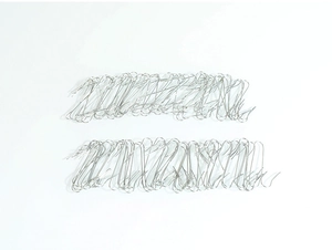Detailed view of silver S-shaped metal hooks neatly arranged for Christmas decorations
