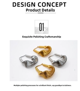 Detailed macro view of U-shaped metal earrings with spiral texture in gold and silver
