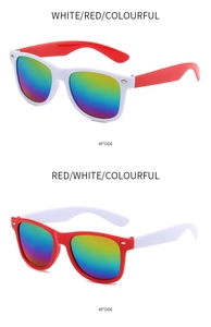 Detail of red and white sunglasses with colorful mirrored lenses in side profile view