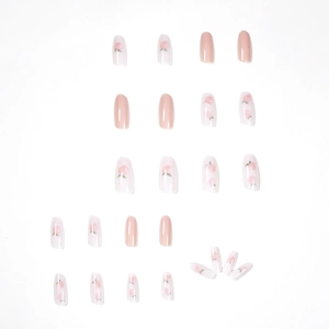 Set of 24 peach pink press-on nails featuring sweet fruit art and glossy oval design
