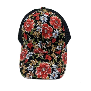 Close-up of a floral mesh baseball cap featuring vibrant red and white flower patterns