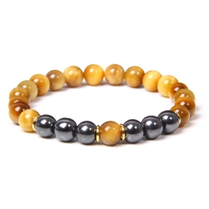 Detail of 8mm natural tiger eye stone beads with metallic spacers on an elastic bracelet