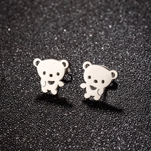 Macro shot of silver stainless steel teddy bear stud earrings with cutout details