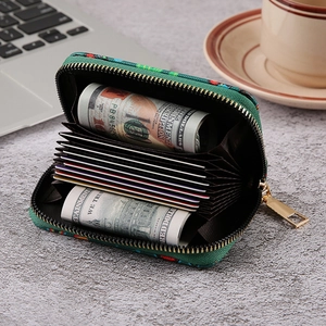 Green canvas gothic skull accordion wallet with zipper closure and multiple card slots