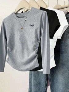 Minimalist long-sleeve T-shirts for women featuring bow embroidery and side ruched detail