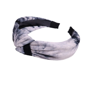 Gray and black tie-dye knotted headband with soft fabric texture on white background