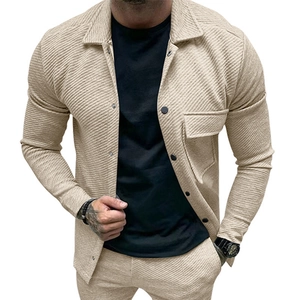 Close-up of khaki twill waffle texture on men's lapel jacket with button detail