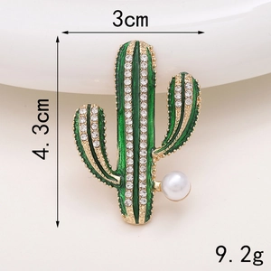 Detail of green enamel cactus brooch with rhinestones and pearl, 4.3cm high x 3cm wide