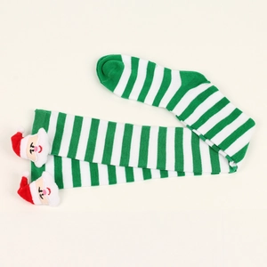 Detailed view of green and white striped Christmas socks with a 3D Santa Claus doll