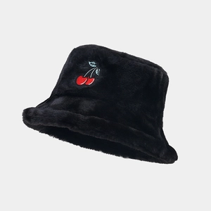 Close-up of cute red cherry embroidery on a warm black faux fur bucket hat for winter