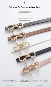 Detail of elegant cowhide leather skinny belts with golden bow buckle in multiple colors