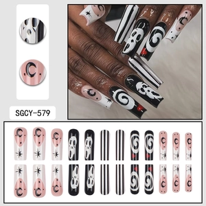 Halloween long coffin press-on nails with Scream ghostface and black stripe patterns