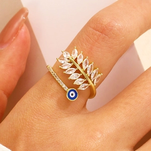 Golden bow leaf ring with evil eye pendant and marquise stones for women