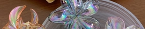 Detailed close-up of iridescent plumeria hair claw clips with shimmering laser finish