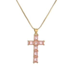 Golden cross necklace with pink baguette zircon stones on a clean white background