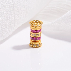 Detailed macro view of S925 silver cylinder bead with rose red and white zircon inlay