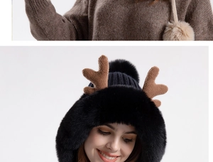 Detail of plush black knitted beanie featuring brown antlers and soft faux fur texture