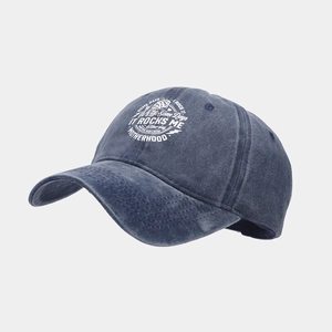 Detail view of washed navy denim baseball cap featuring Motherhood embroidery print