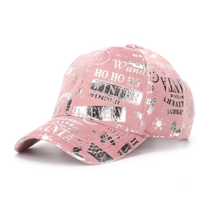 Detail of pink Christmas baseball cap with reflective silver Santa and snowflake prints