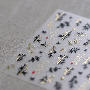 Embossed bamboo and butterfly 3D nail stickers with golden foil and black detailing