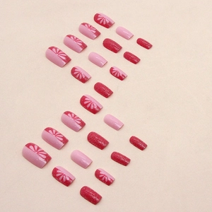 Glitzernde rosa künstliche Nägel mit Blütenmuster und roten Akzenten 24er Set