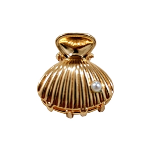 Golden starfish metal hair claw clip with pearl detail on a white background